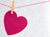 red heart cutout on a clothesline 