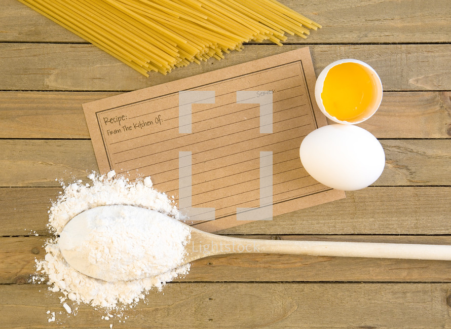 wooden spoon, flour, eggs, and pasta 