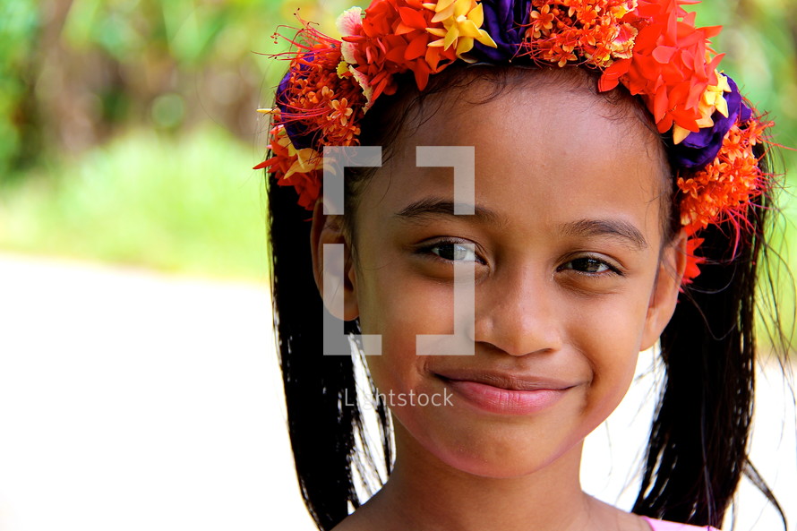 Flowers in a young Polynesian girls hair 