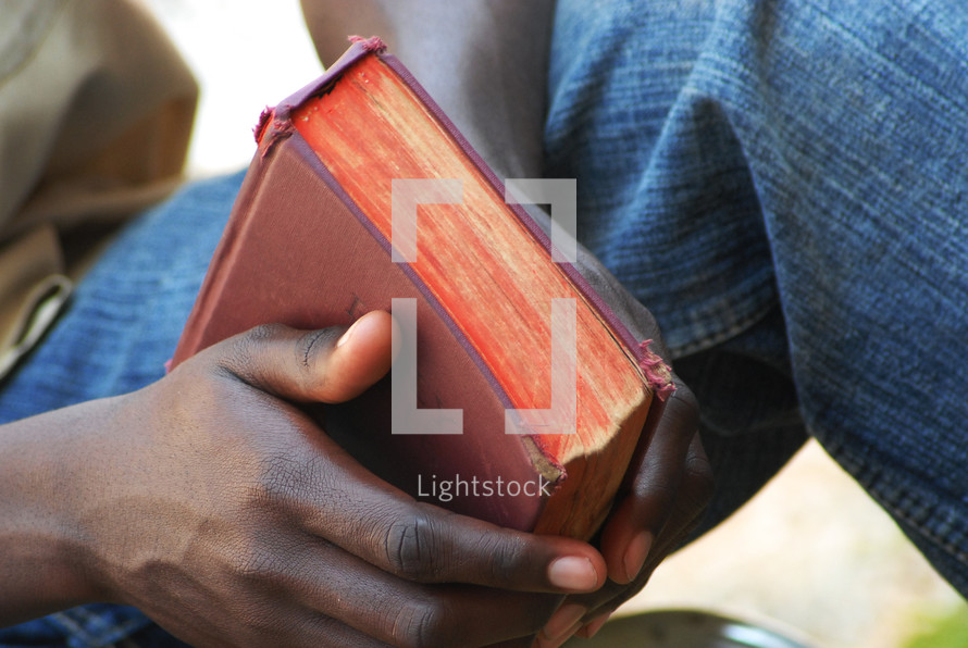 man holding a Bible