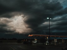 storm clouds over a gas station 