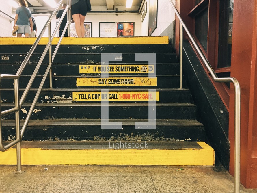 steps in a subway station, if you see something say something 