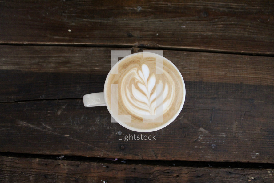 design in creamer in a coffee cup 