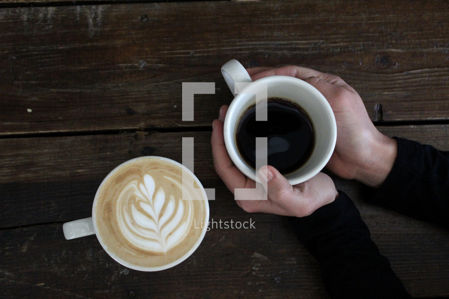 design in coffee creamer and black coffee 