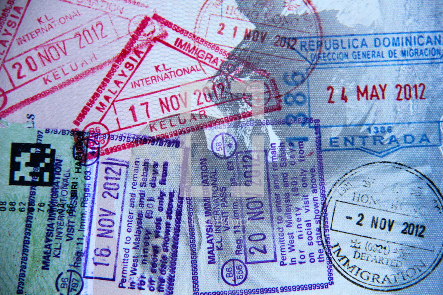 Border crossing stamps in a passport