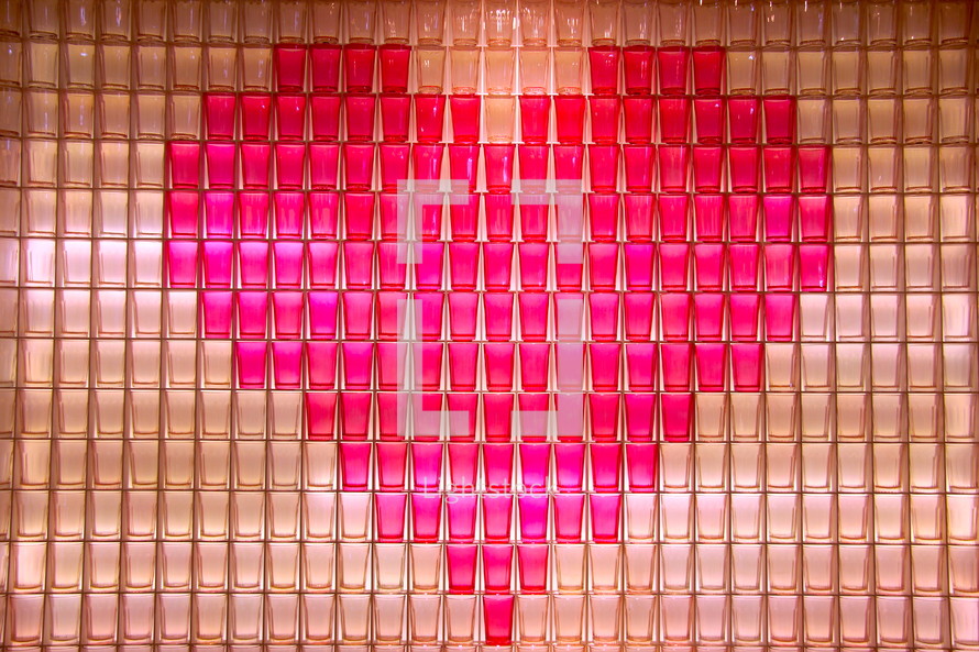 Red heart shape made from stacked communion cups 