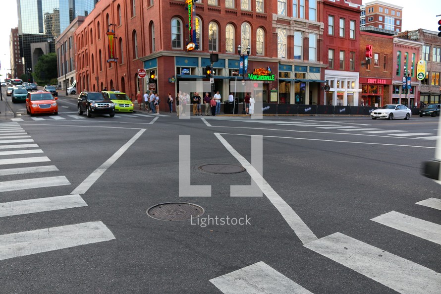 crosswalks and traffic in a downtown street 