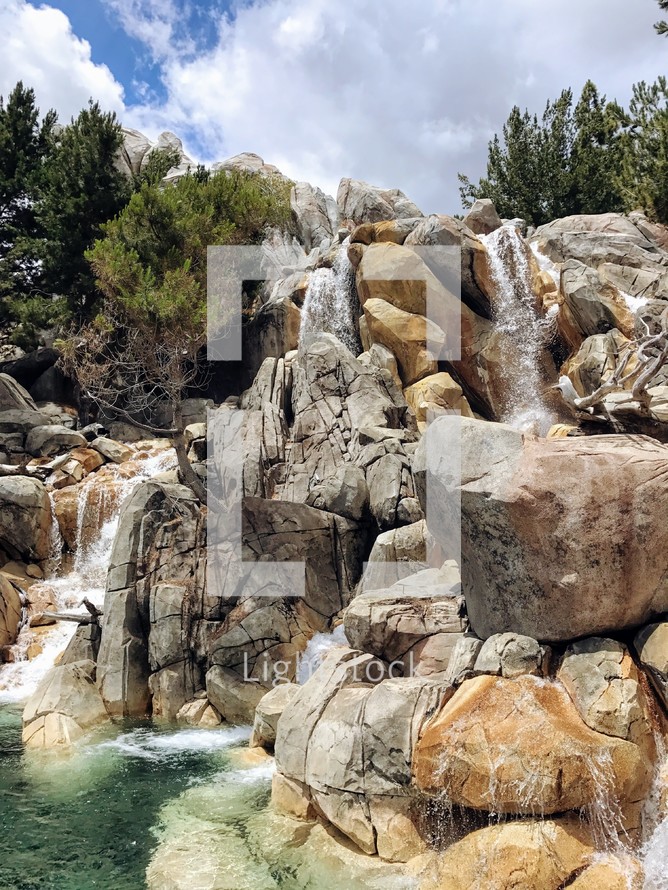 waterfall over boulders 