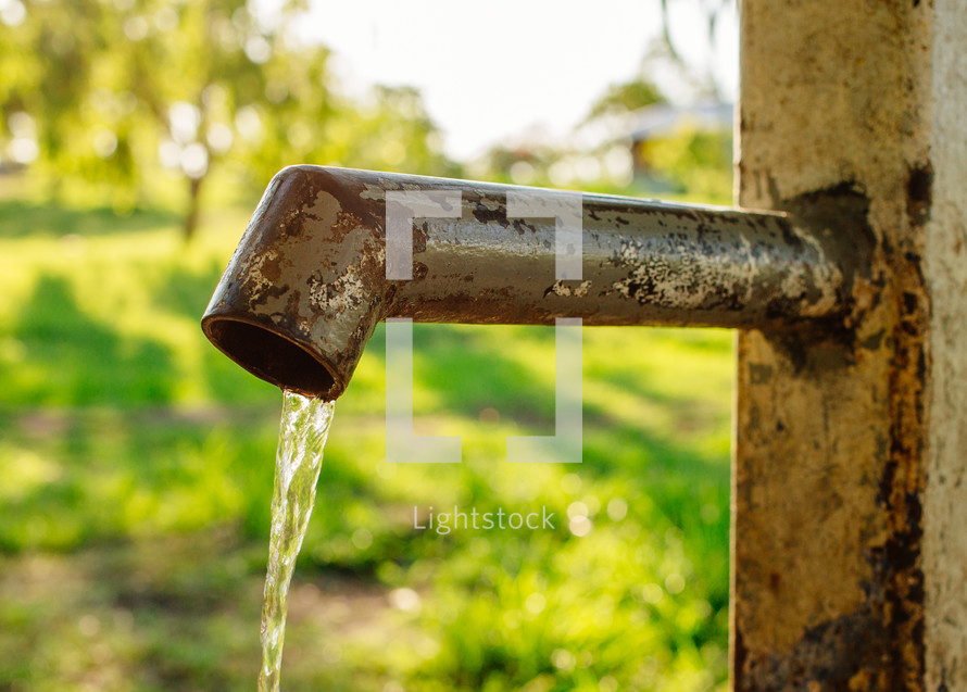 water from a pipe spigot 