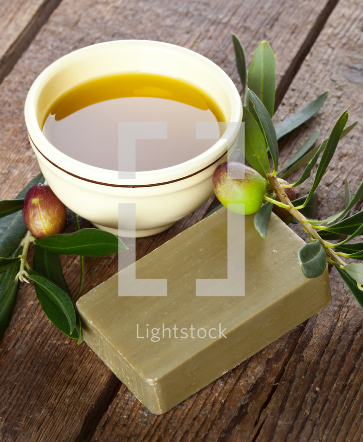 Aleppo soap and Olives on wooden table