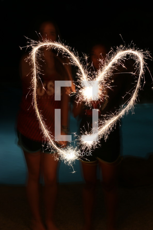 sparklers forming a heart shape 