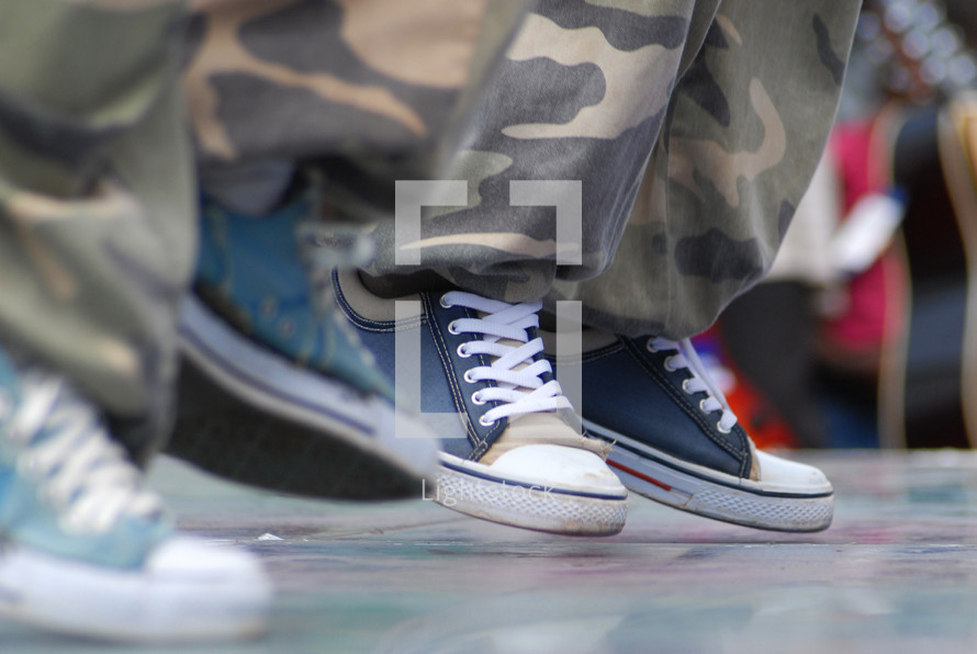 sneakers and camouflage pants 