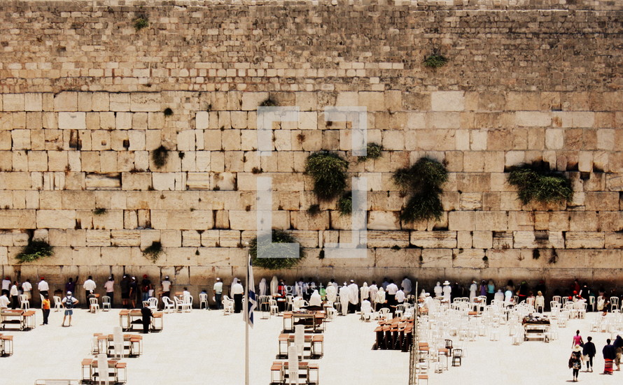 visitors to the wailing wall in the Holy Land