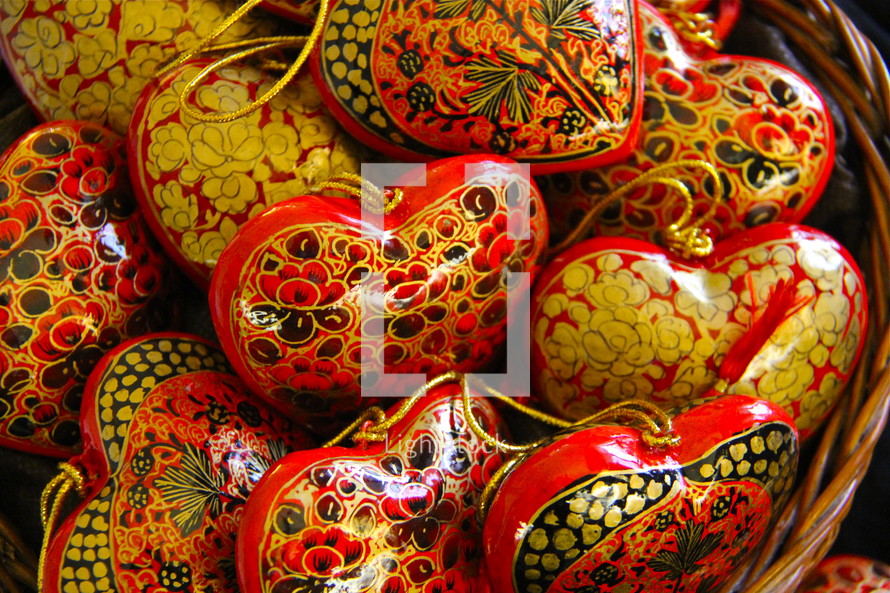 basket of heart shaped hand made wooden ornaments