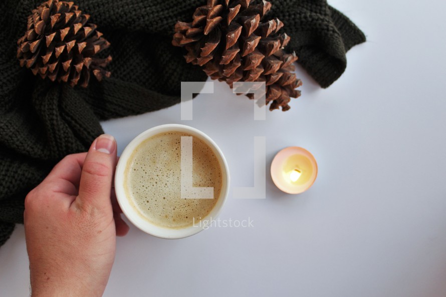 pine cones, latte, and knit scarf 