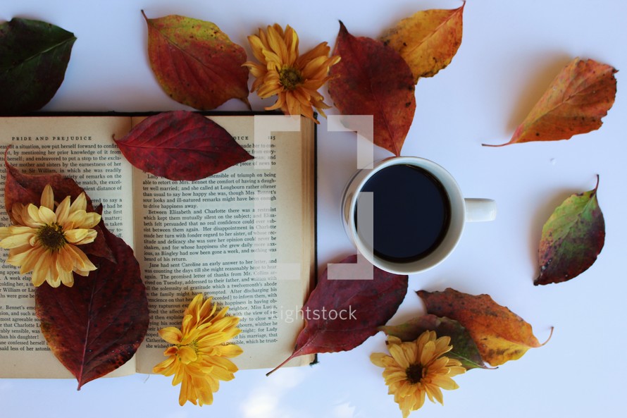 open book, fall leaves, and coffee cup 