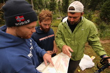 friends looking at a map before a hike 