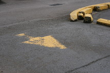 a curve in the road and an arrow pointing the way