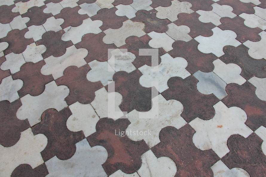 puzzle piece pattern on a tile floor