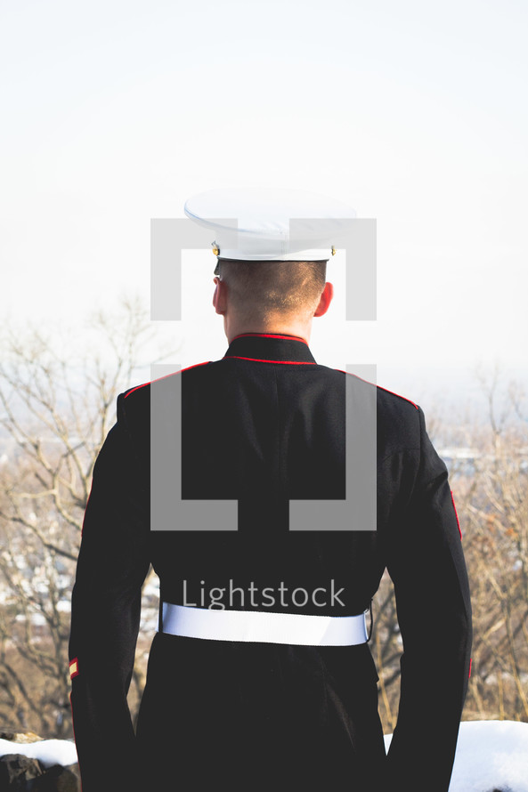 marine in uniform with back turned to camera 