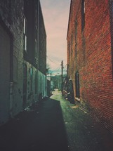 narrow alley between two buildings 