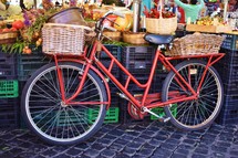 red bicycle at a market 