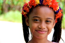 Flowers in a young Polynesian girls hair 