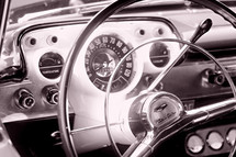 steering wheel and dash  of an old 57' chevy bel air car auto automobile automotive classic