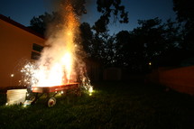 fireworks exploding in a red wagon