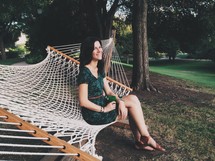 woman sitting on a hammock 
