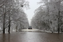 flooded street and winter ice storm 