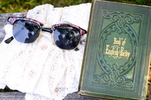 Poetry book and sunglasses