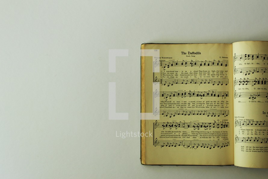 Open hymnal pages on a white background 