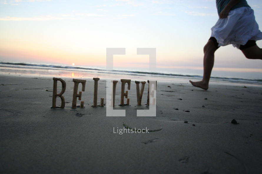 Believe written in the sand
