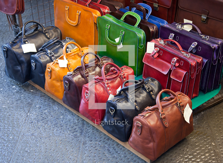 Leather bags for sale in the markets of Florence, Italy.