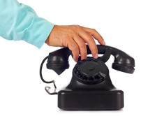 Old retro bakelite telephone on white background