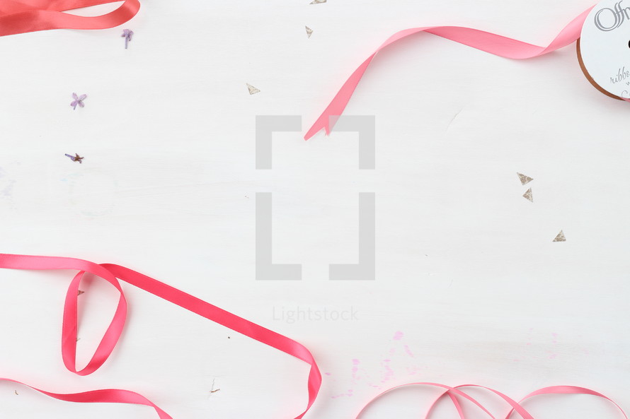 pink ribbons on a white background 