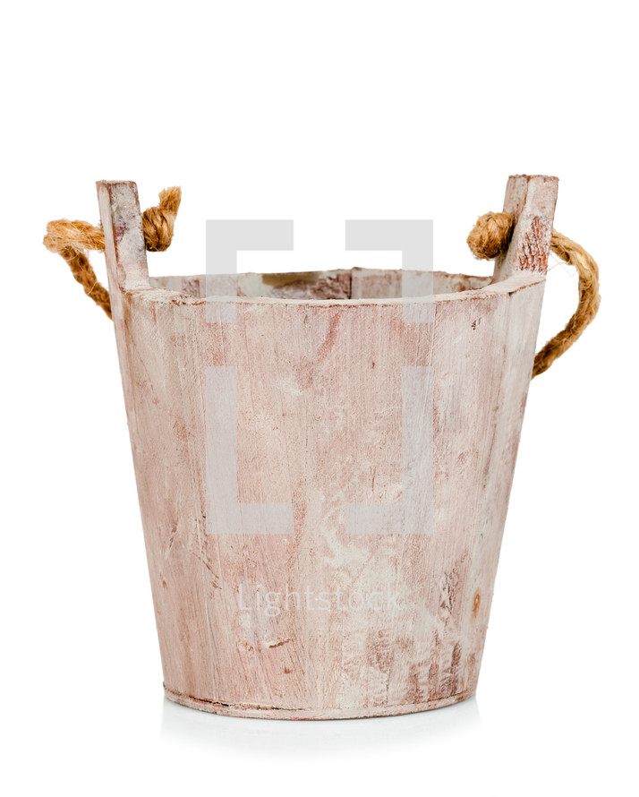 Empty wooden bucket or wooden flowerpot on white.