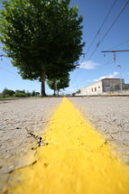 yellow road stripe on a dirt road