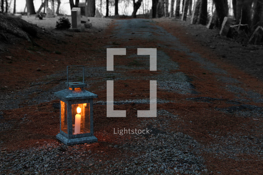lantern on gravel road 