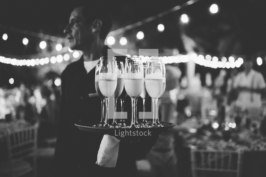 waiter serving champagne at a wedding reception