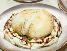 Smoked provola, traditional italian cheese in a tray