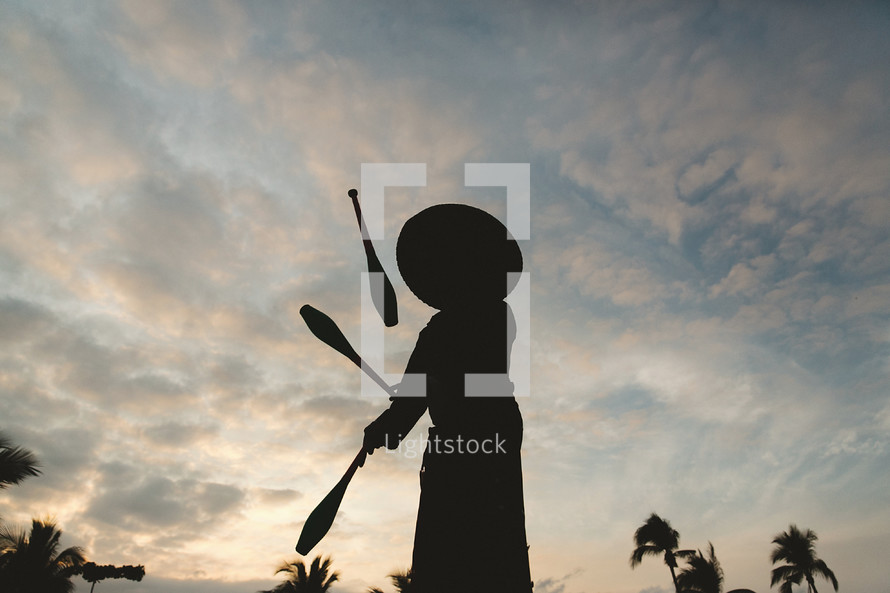 silhouette of a juggler 