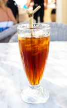 Cold iced tea with straw