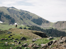 man hiking up a mountain 
