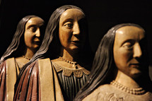 carved wood statues of women