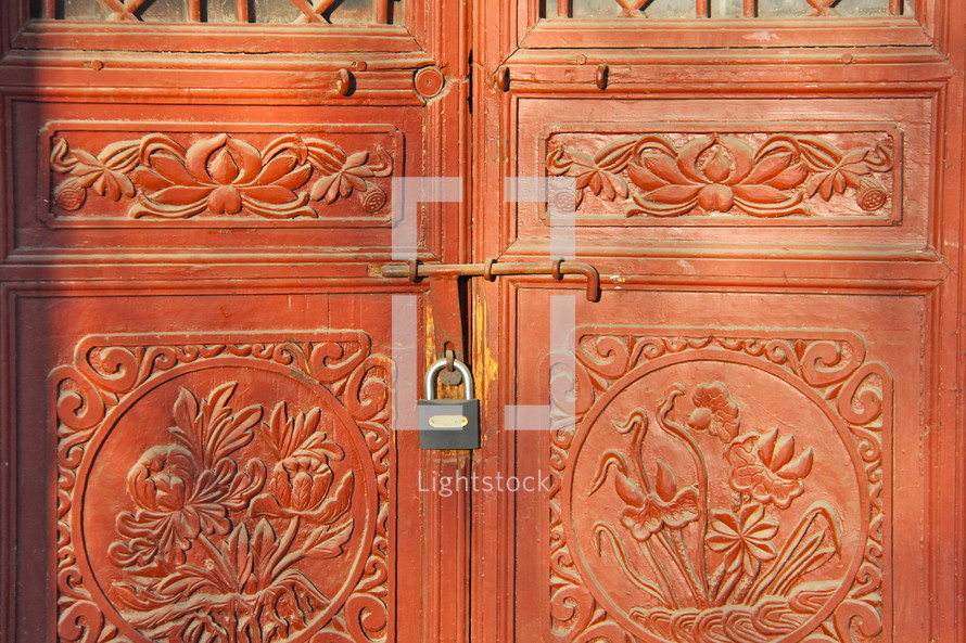 padlock on red doors in China