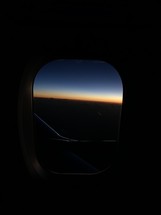 view from a plane window at dawn 