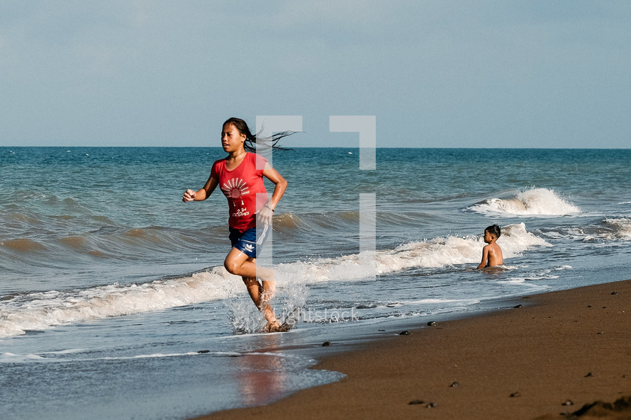 girl running on a beach 
