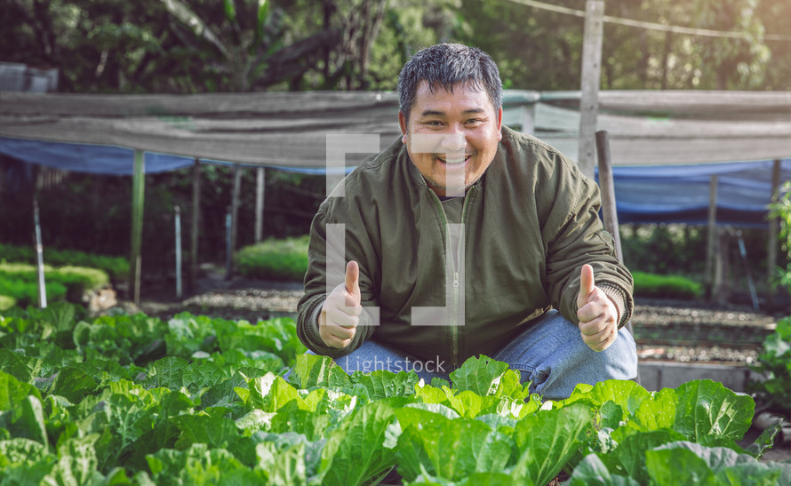 a man gardening giving a thumbs up 
